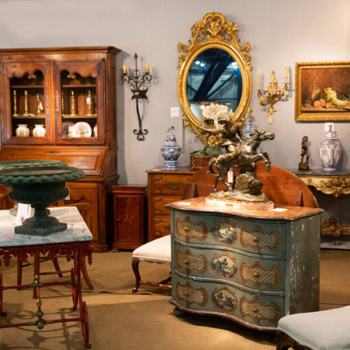 Antique furniture and decor in showroom.